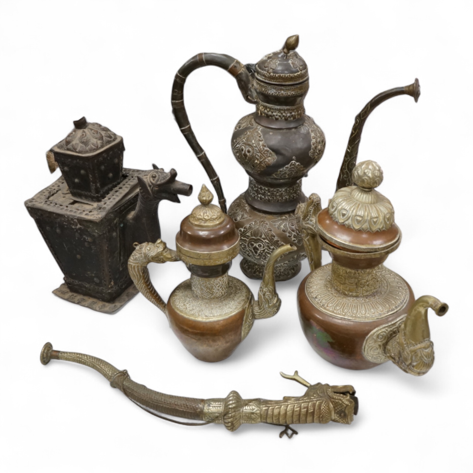 A collection of Asian embossed metalware, largest 41cm high